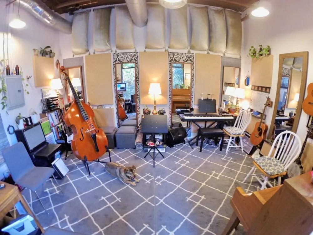 Studio overview with upright bass and chairs