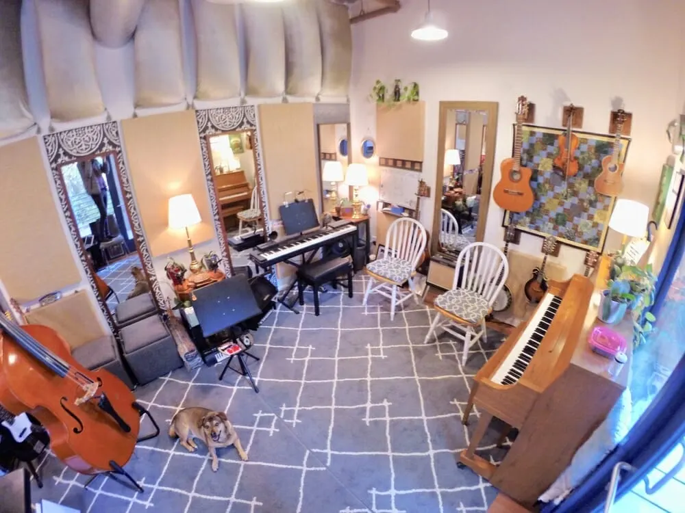 Studio interior with piano and guitars